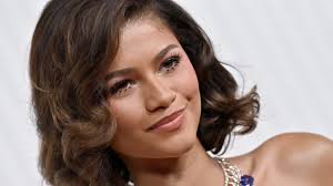 Zendaya in a red carpet event, radiating confidence and style.
